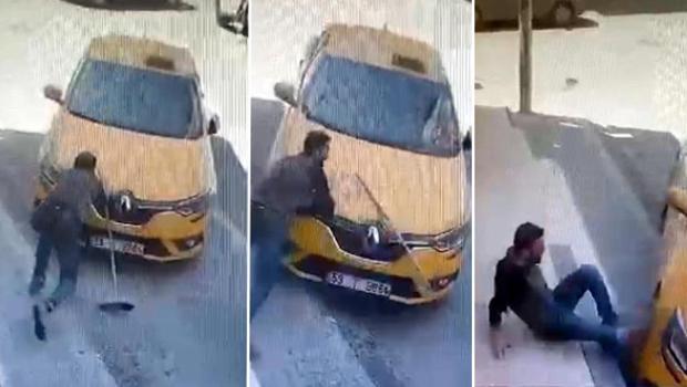 El freni çekilmeyen taksiyi, önüne geçip durdurmak istedi