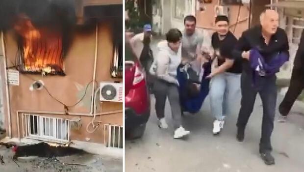Gaziosmanpaşa'da yangında mahsur kalan kadını sürükleyerek çıkardı