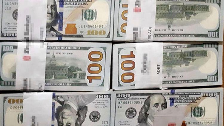 Çöpe atılan 70 bin dolarının izini takip edip buldu