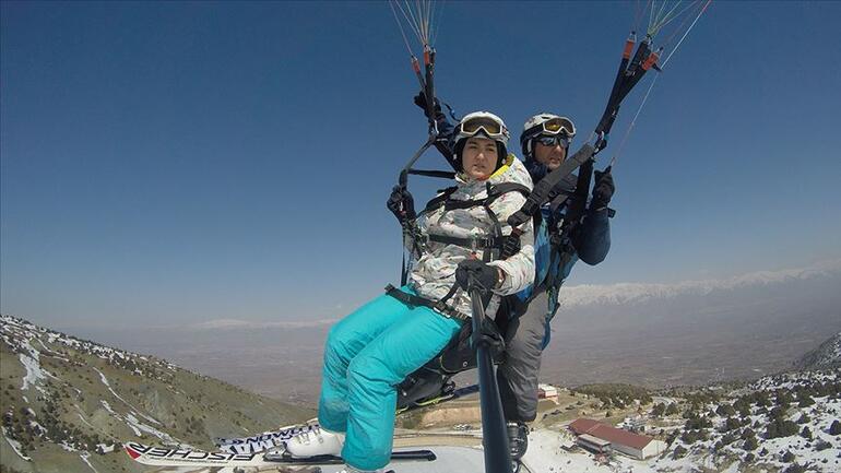 Adrenalin tutkunu baba kızın paraşütlü kayak keyfi