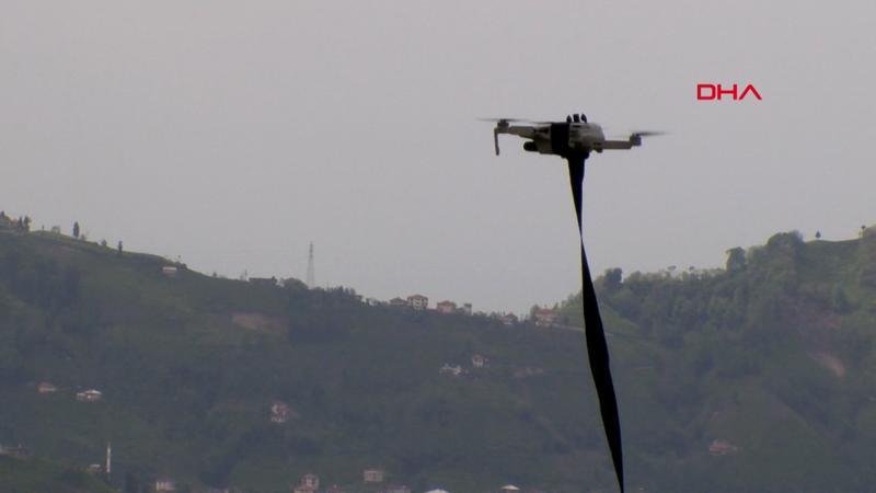 Village head uses drone to distribute face masks to residents