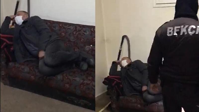 Polis ekiplerinin baskını sırasında bir kişinin, uyuyor gibi davranması kameralara yansıdı.