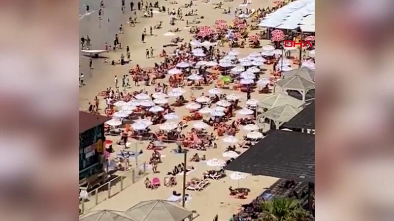 Maske zorunluluğunun kalktığı İsrail'de halk plajlara akın etti