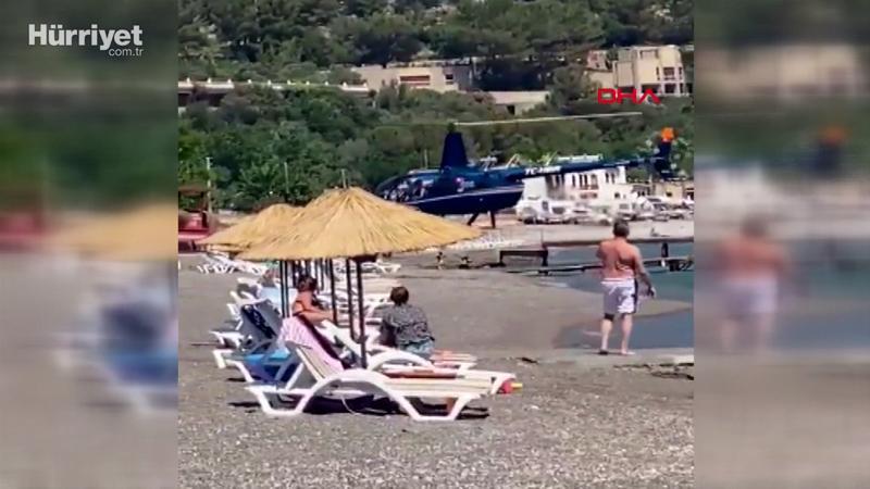 Helikopter plaja indi, güneşlenenler şaşkınlık yaşadı