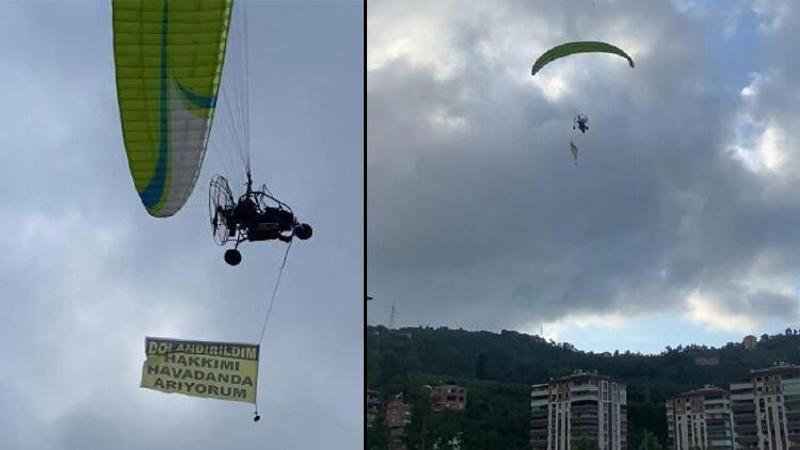 Kiraladığı paramotorla 'Dolandırıldım, hakkımı arıyorum' yazılı afişle uçtu