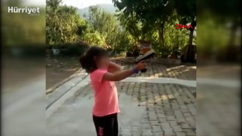 Küçük kıza zorla ateş ettirdi, vurulma tehlikesi atlattı