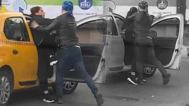 Taksideki kadın ile eğitmenin arbedesi kamerada
